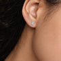 Woman styling 2ct Emerald-Cut Lab Grown Diamond Halo Stud Earrings by Fortune Jewellery