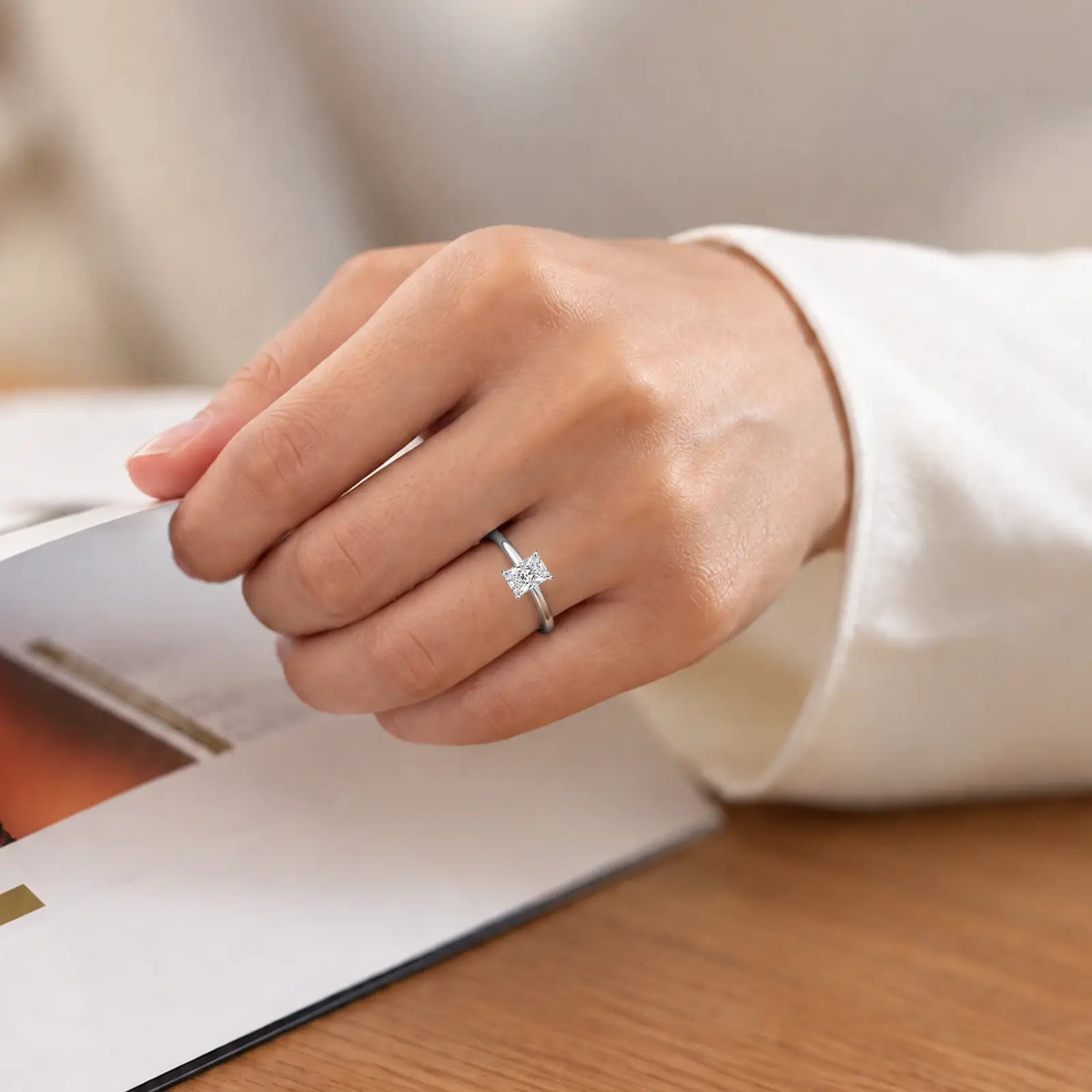 Woman styling 2 Ct Emerald Cut Diamond Solitaire Ring by Fortune Jewellery