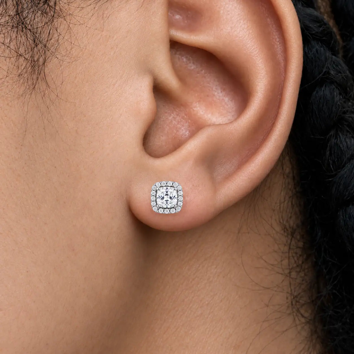 Close-up view of woman wearing 4ct Luxurious Cushion-Cut Lab Grown Diamond Halo Earrings