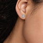 Woman wearing 8ct Emerald-Cut Grand Halo Diamond Stud Earrings by Fortune Jewellery