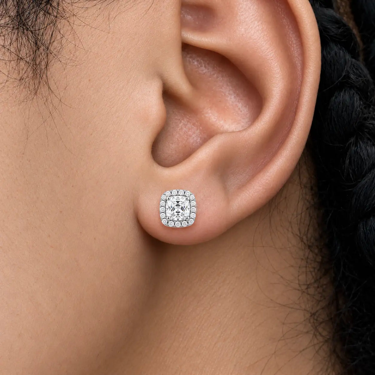 Close-up of model wearing 8ct Cushion-Cut Lab Grown Diamond Halo Earrings