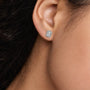 Woman wearing 10ct Emerald-Cut Diamond Halo Stud Earrings by Fortune Jewellery