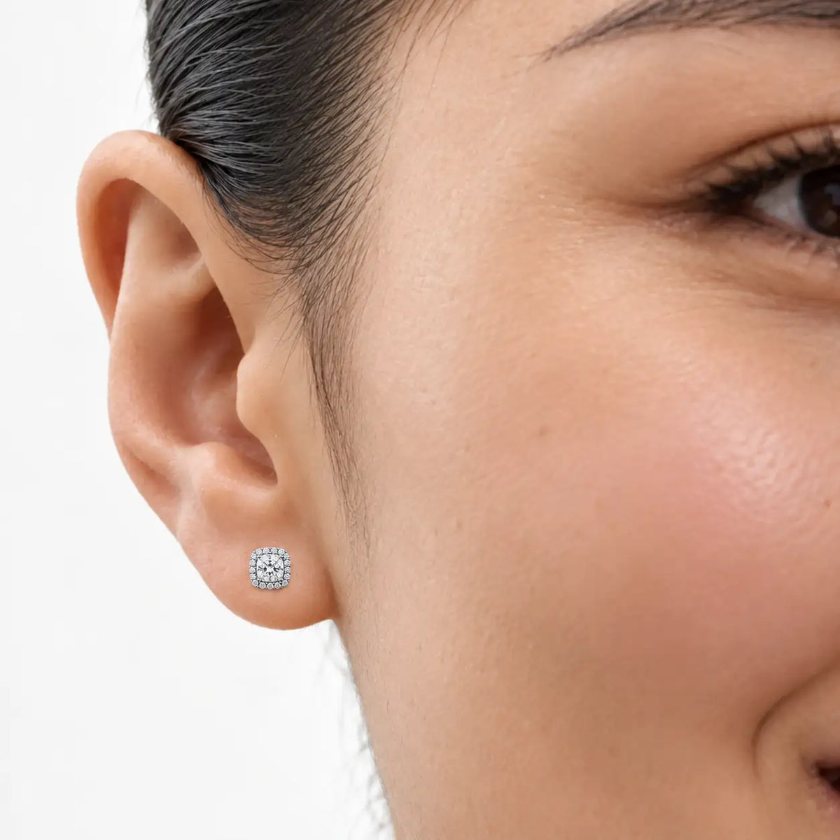 Woman styling 1.5ct Premium Cushion-Cut Lab Grown Diamond Halo Earrings by Fortune Jewellery