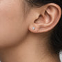 Closeup of women wearing 1ct Cushion-Cut Lab Diamond Solitaire Stud Earrings by Fortune Jewellery