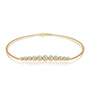 Yellow gold graduated bezel set diamond station bracelet 