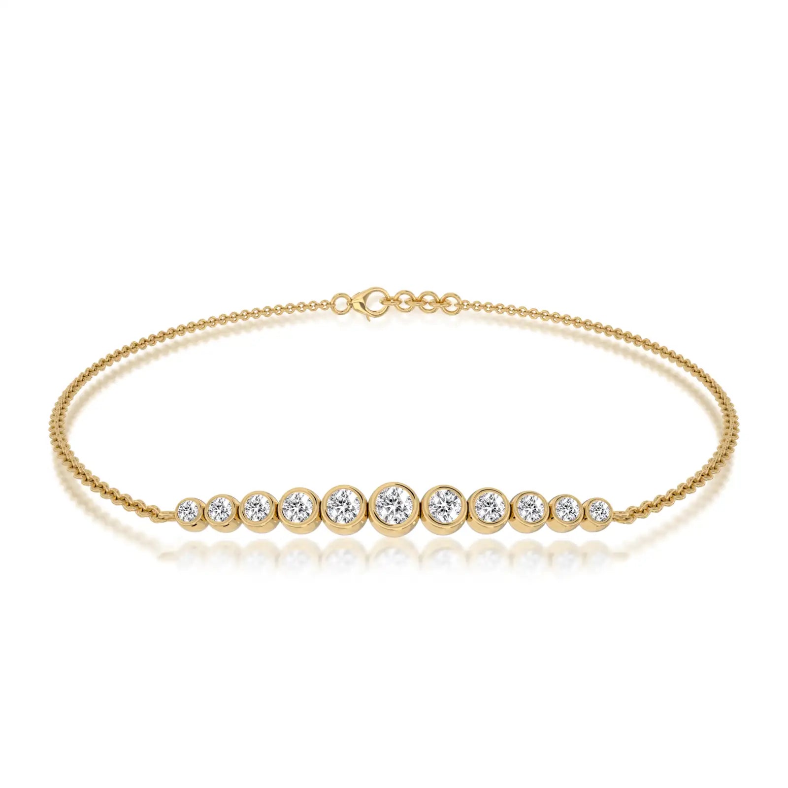 Yellow gold graduated bezel set diamond station bracelet 