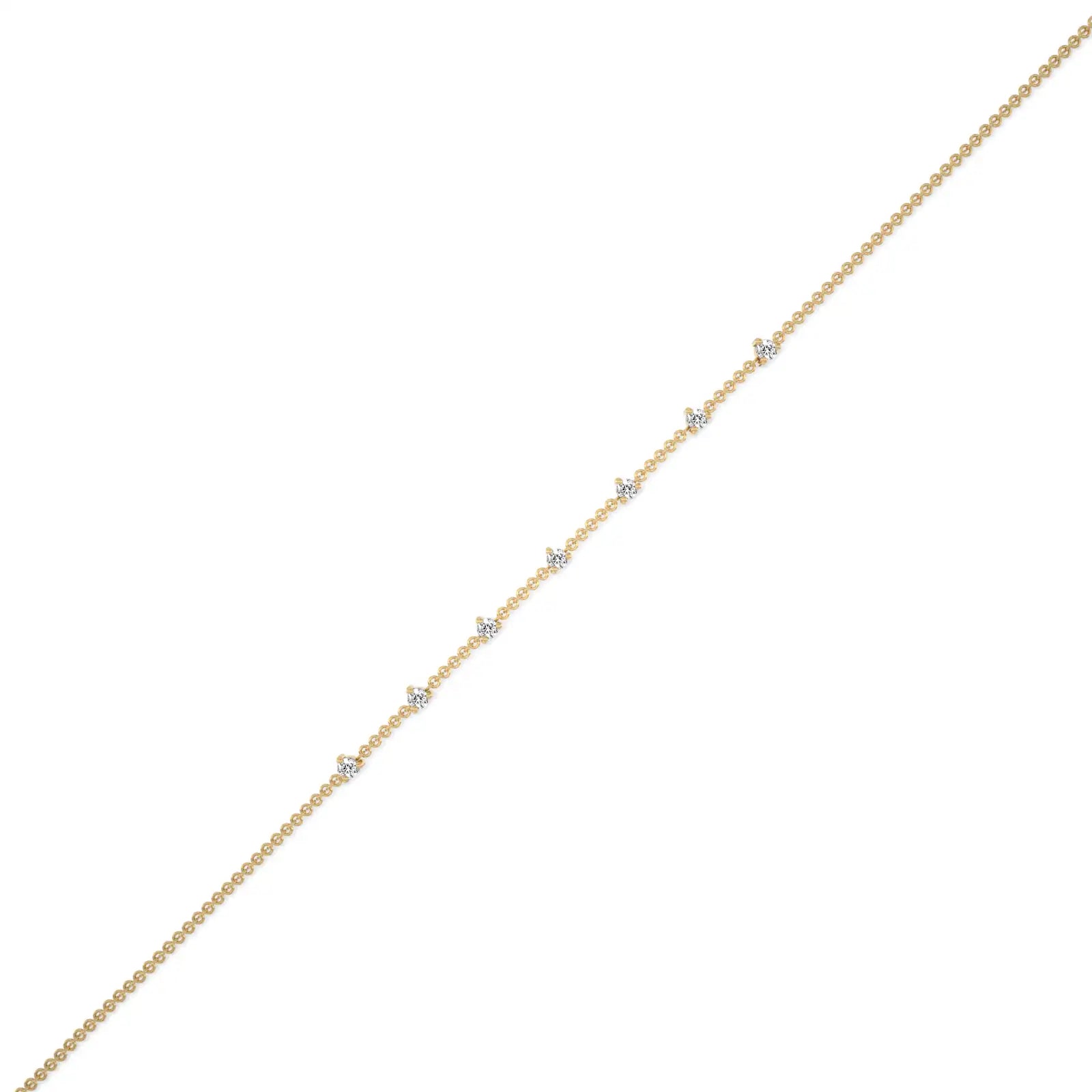 Trendy yellow gold prong set diamond station bracelet