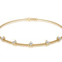 Yellow gold prong set diamond station bracelet for women