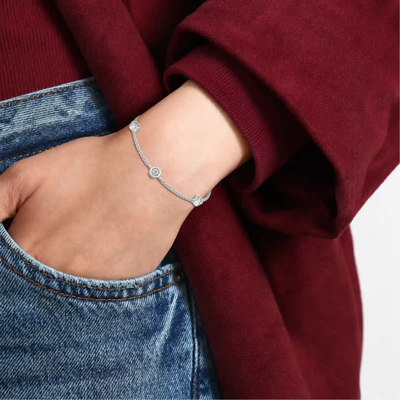Close-up of Celestia Bezel Diamond Station Bracelet on a woman's wrist