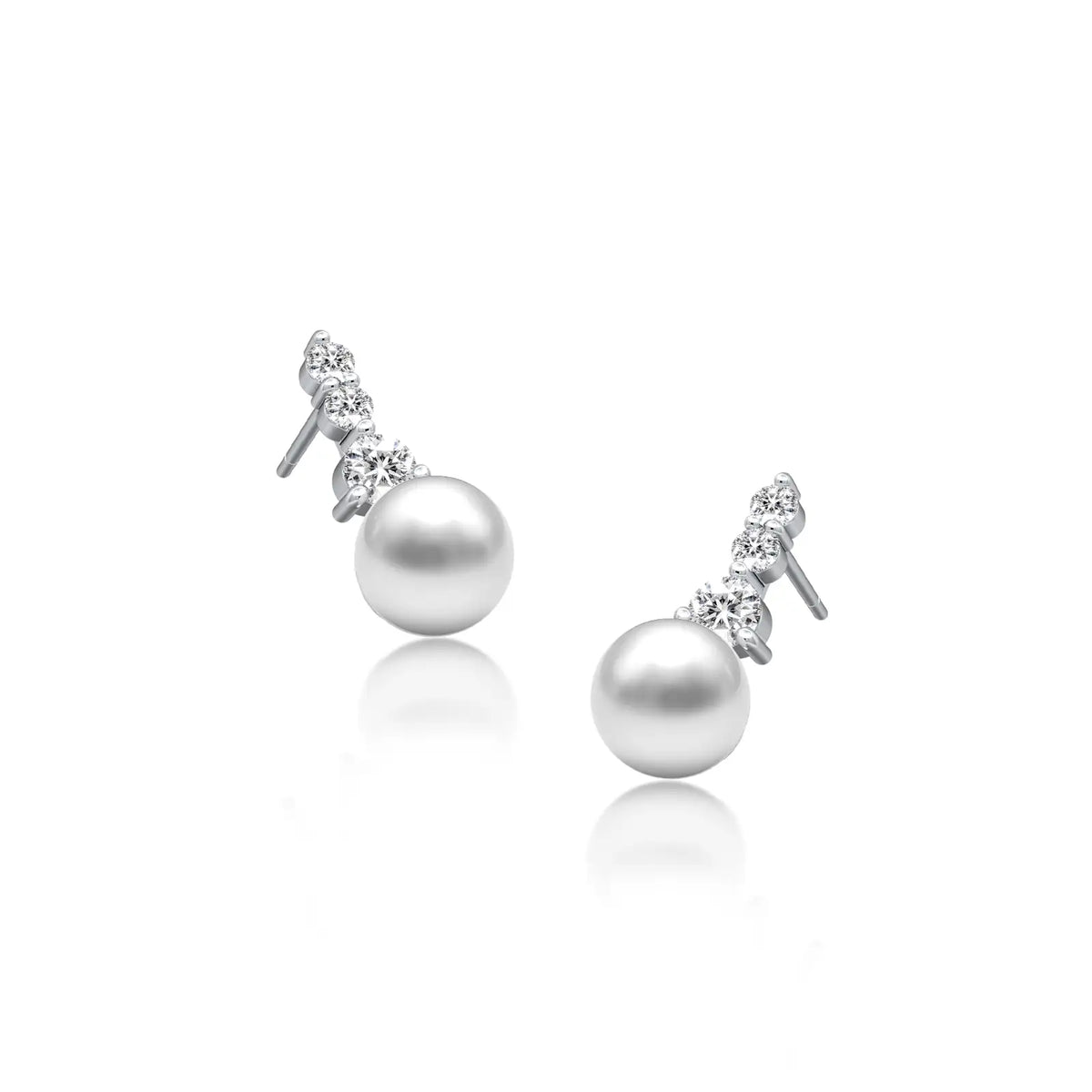 Graduated diamond trio pearl drop earrings