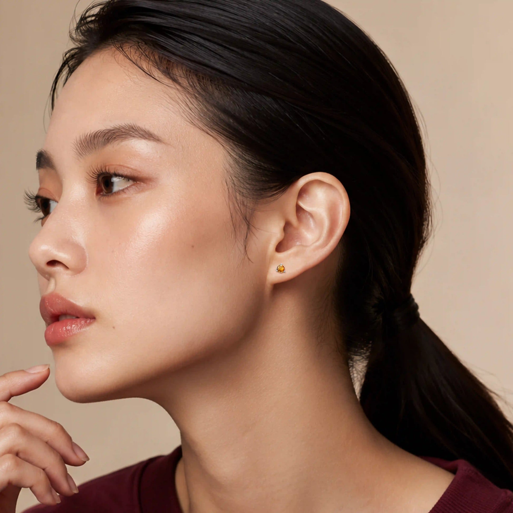 Model wearing fortune november birthstone citrine earrings