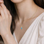 Model image of march birthstone pear shaped swiss blue topaz and diamond pendant