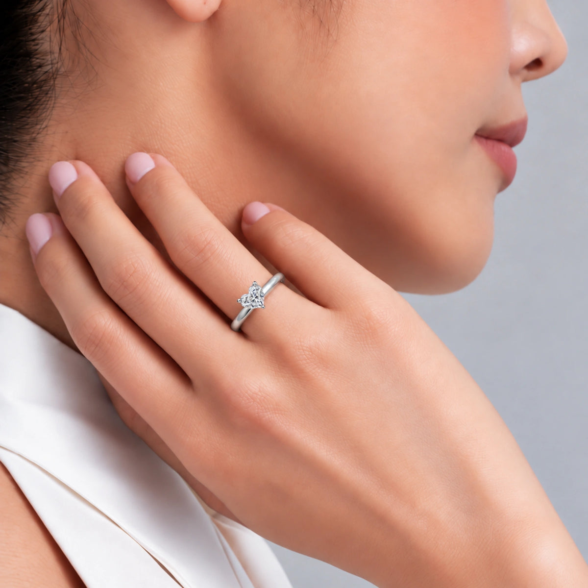Model Wearing a Royal Elegance 0.5 Ct Heart Cut Diamond Solitaire Ring for Women
