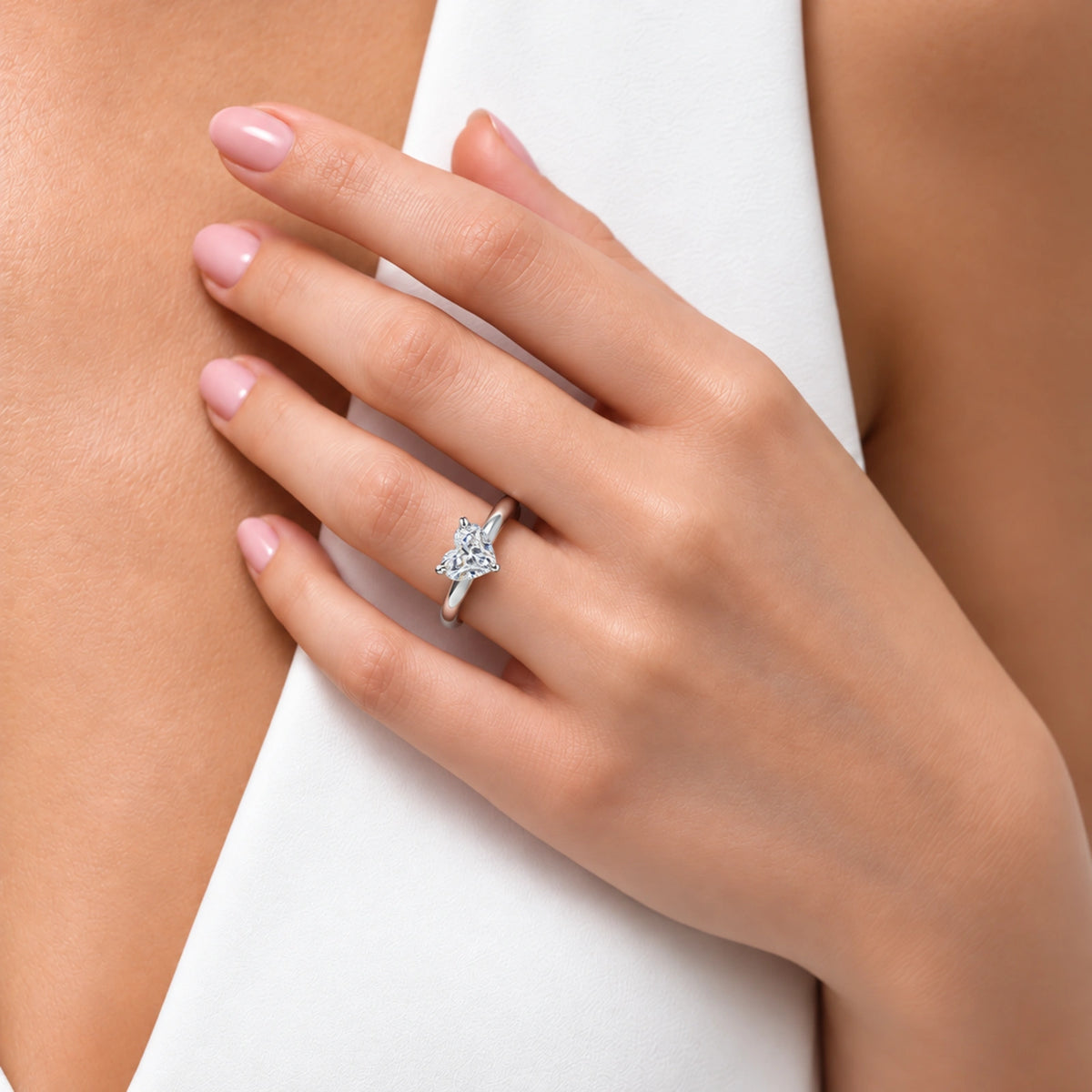 Model Wearing a Sparkling Heart Cut Diamond Engagement Ring