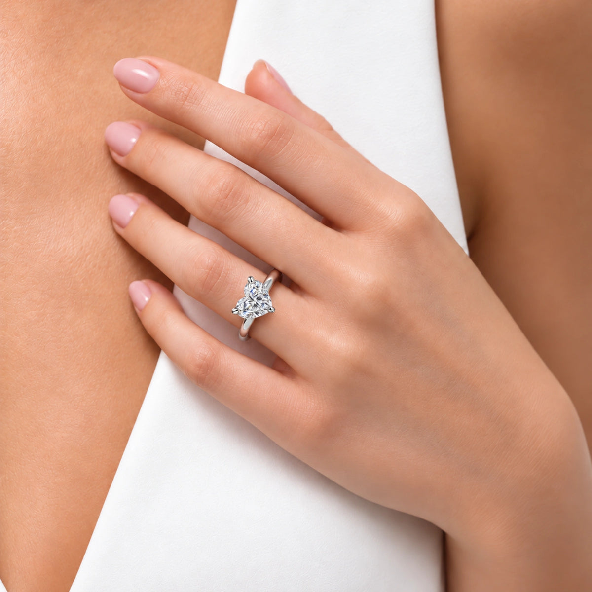 Model Wearing a Sparkling Heart Cut Diamond Engagement Ring